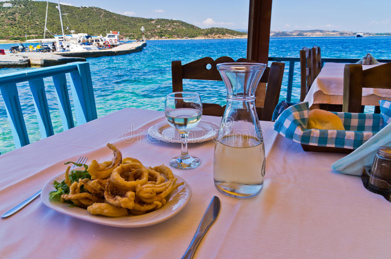 Calamari and wine at harbourside Greek taverna